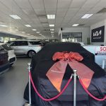 Young lady appreciates her mother for buying her a car - lady mother buy kia